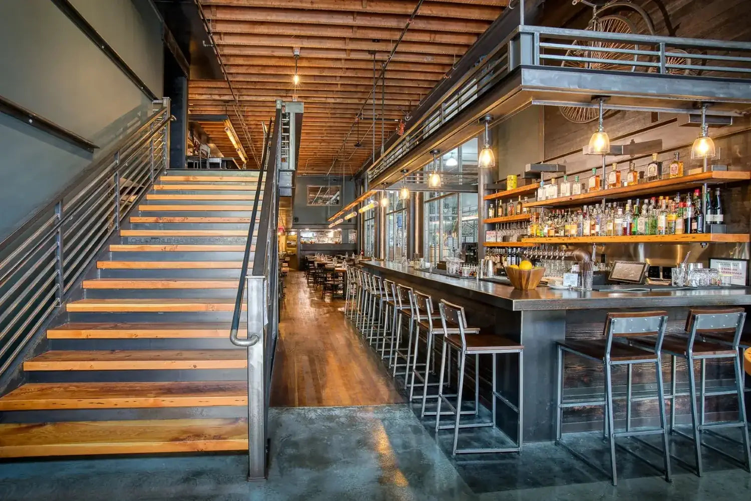The long bar and back bar shelves at Penny Farthing