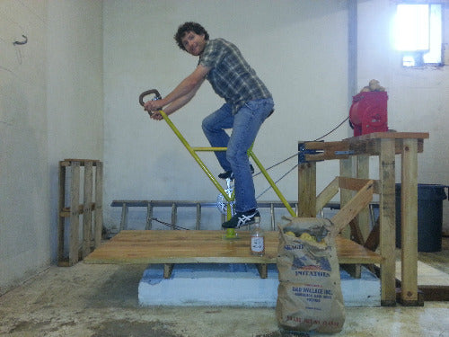 Matt on bike grinding potatoes