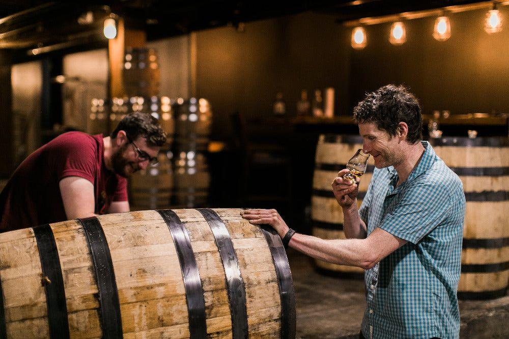 Matt and Kelly nosing whiskey straight from the barrel