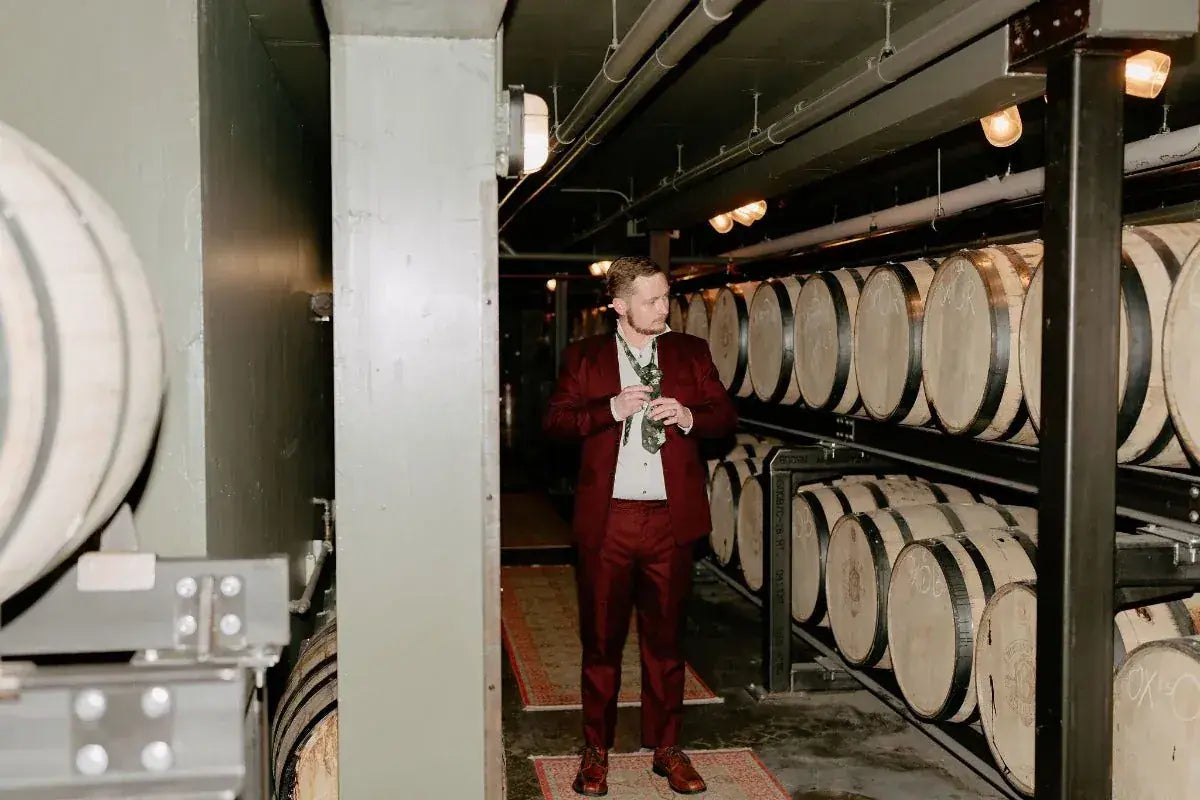 A toast among the barrels in the barrel room