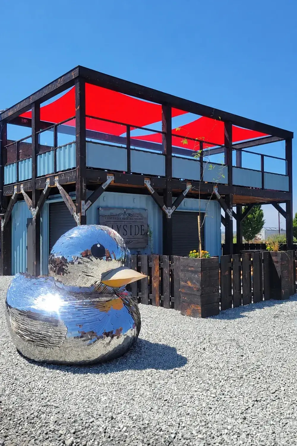 Bayside’s container bar with the mirrored duck sculpture