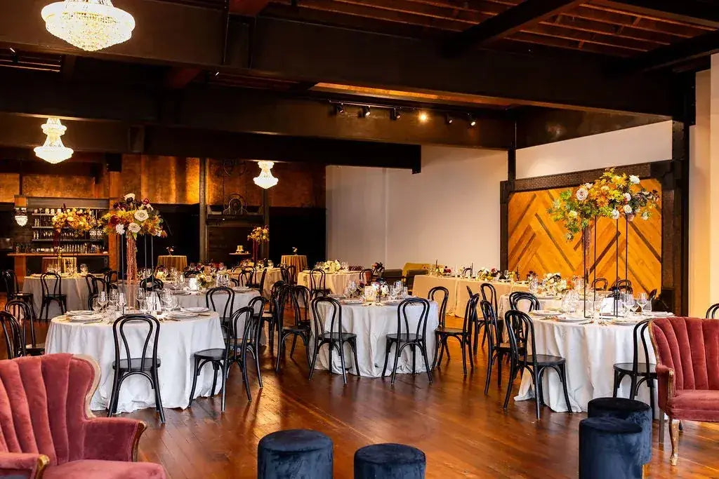The ballroom set for a reception with copper accents