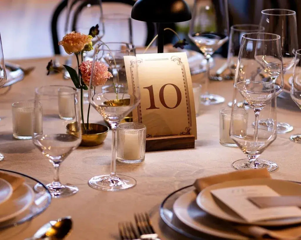 A place setting with table number 10 and fresh flowers